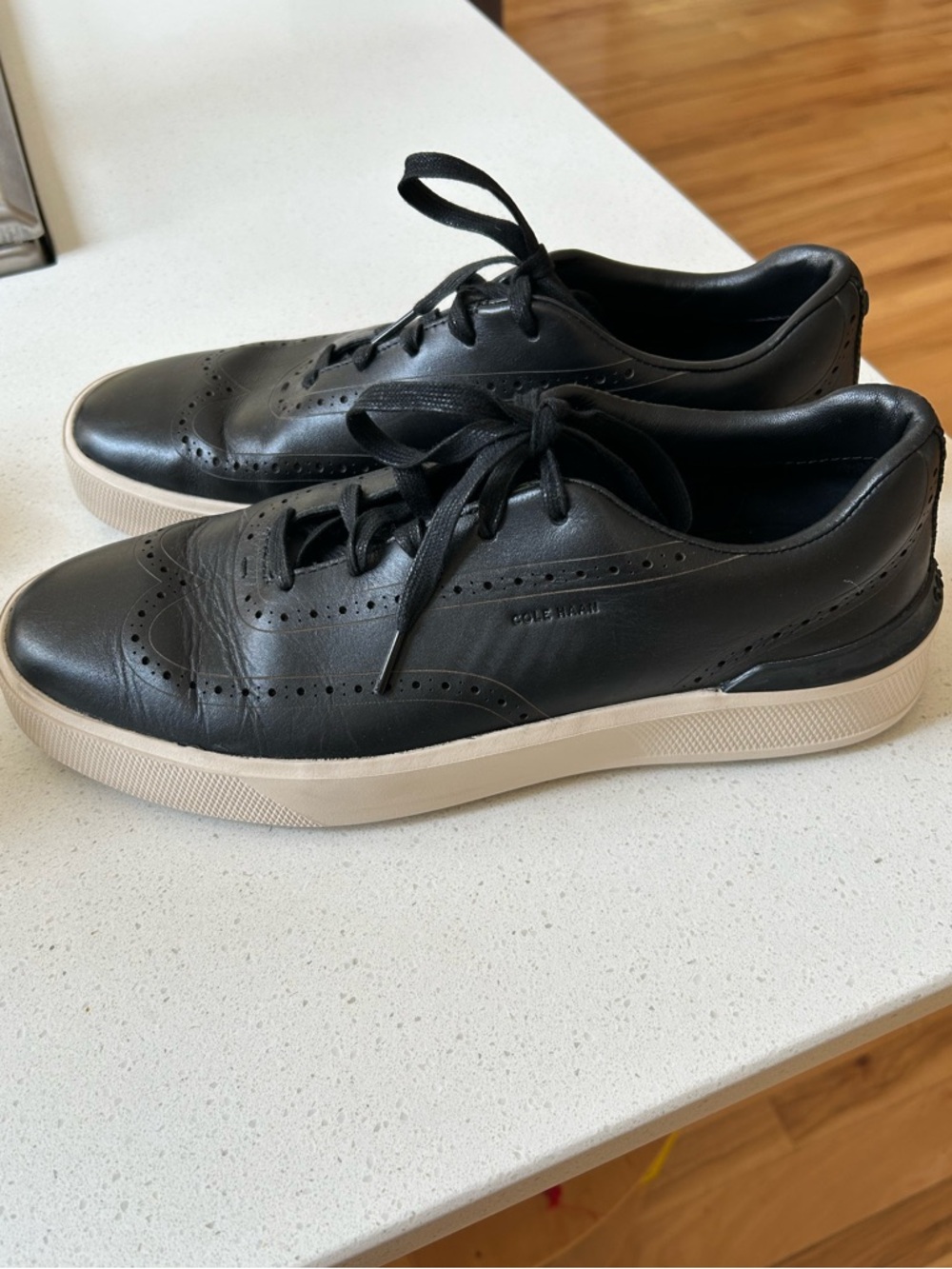 Cole Haan Black Leather Wingtip-Style Sneaker with Cream Sole